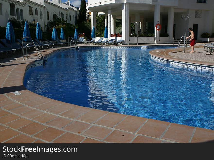 Person Showering Before Entering A Swimming Pool