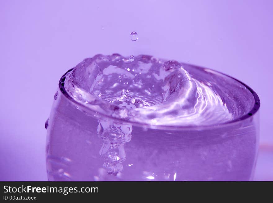 Glass with water, splashes waterdrops, bubbles. Glass with water, splashes waterdrops, bubbles