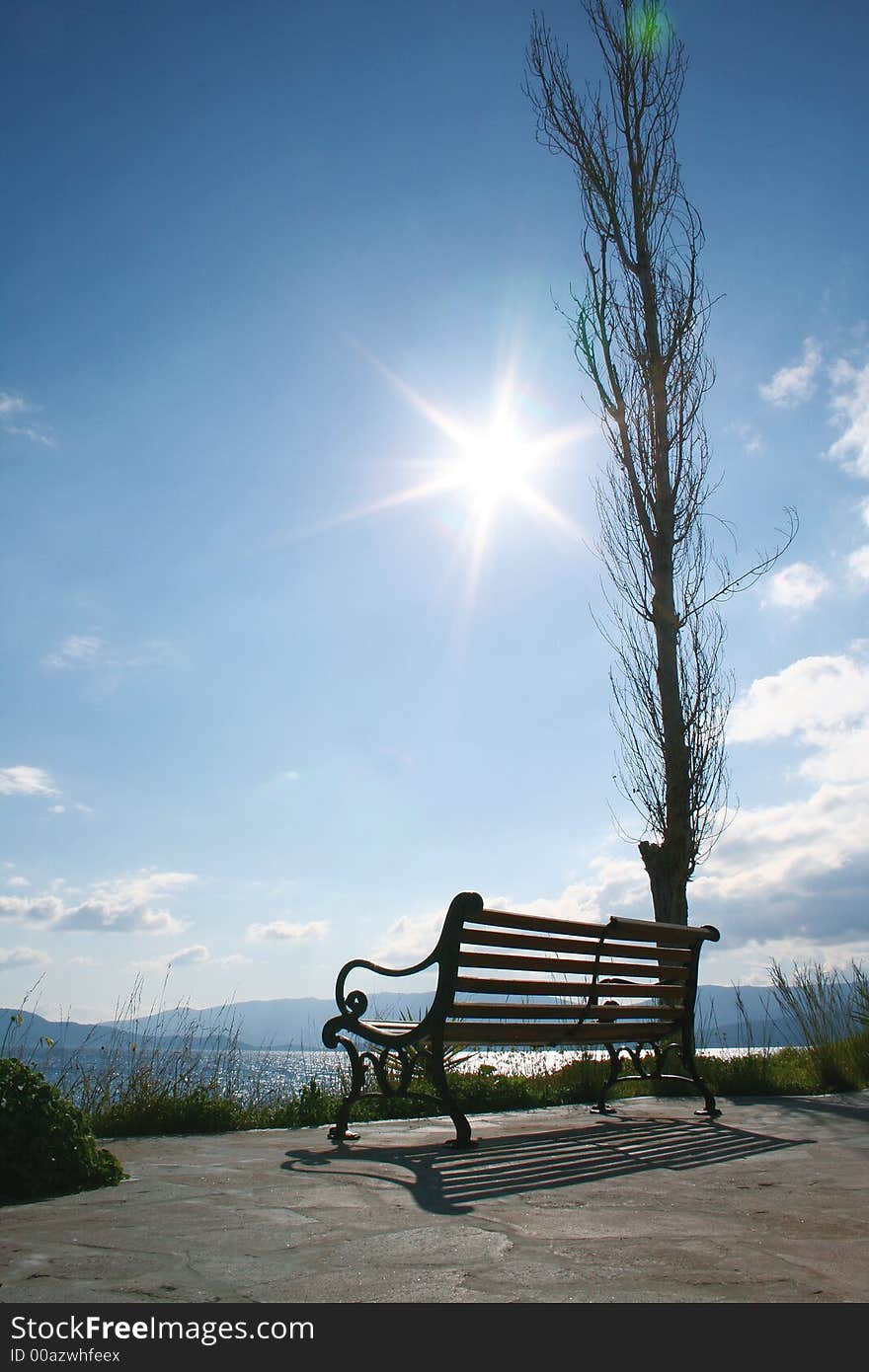 Wooden bench under the morning sun of spring. Wooden bench under the morning sun of spring