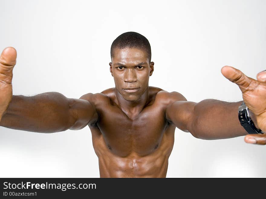 Muscular african american Athelete reaching towards you. Muscular african american Athelete reaching towards you