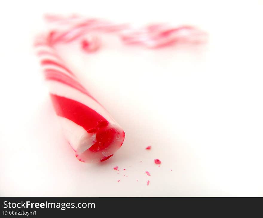 Closeup isolated several candy canes with small chips. Closeup isolated several candy canes with small chips