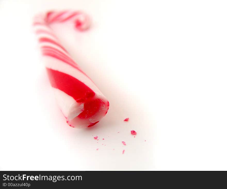 Closeup isolated candy cane with small chips. Closeup isolated candy cane with small chips