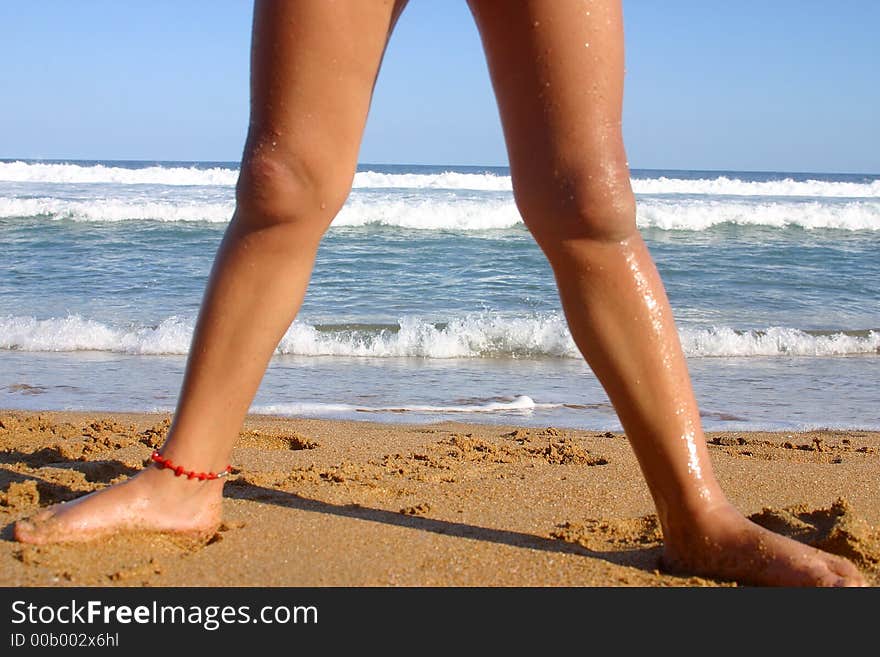 Legs forming an arch at the bay of San Agustinillo in the southern state of Oaxaca in Mexico, Latinamerica. Legs forming an arch at the bay of San Agustinillo in the southern state of Oaxaca in Mexico, Latinamerica