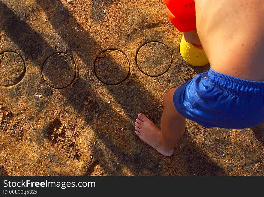 Boy playing at the beach of the bay of San Agustinillo in the southern state of Oaxaca in Mexico, Latinamerica