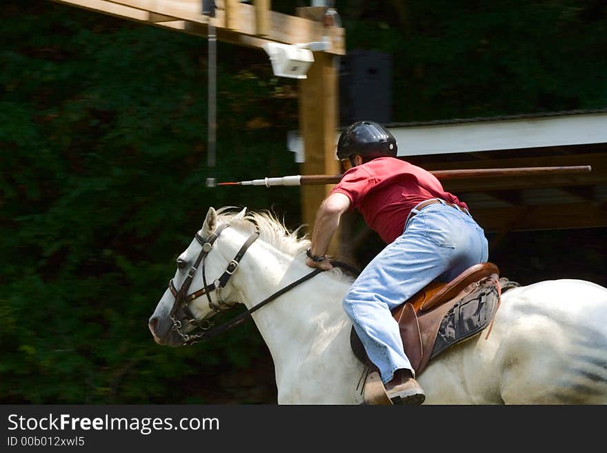 A jouster about to spear a ring. A jouster about to spear a ring