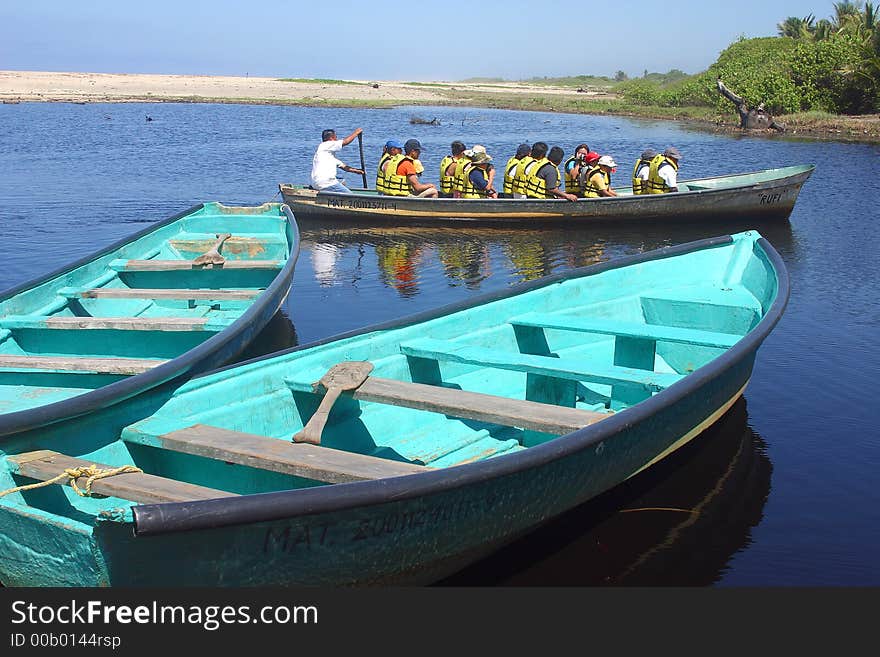 Boat in the river for the tour to a crocodile farm and to go crocodile watching in tne proximity of San Agustinillo in the southern State of Oaxaca in Mexico, Latin America