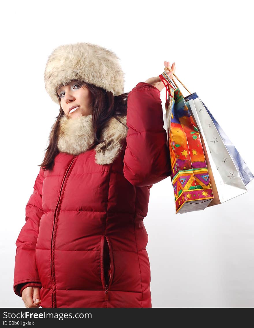 Attractive woman with shopping bags on white background. Attractive woman with shopping bags on white background