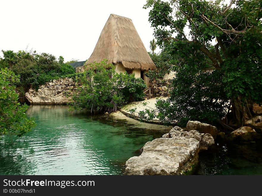 Old typical house with high roof at lake margin. Old typical house with high roof at lake margin