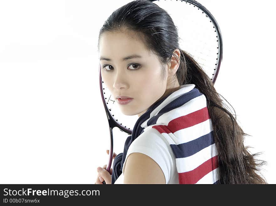 Studio portrait of a asian girl with a tennis racket. Studio portrait of a asian girl with a tennis racket