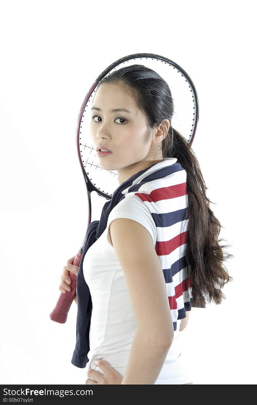 Studio portrait of a asian girl with a tennis racket. Studio portrait of a asian girl with a tennis racket