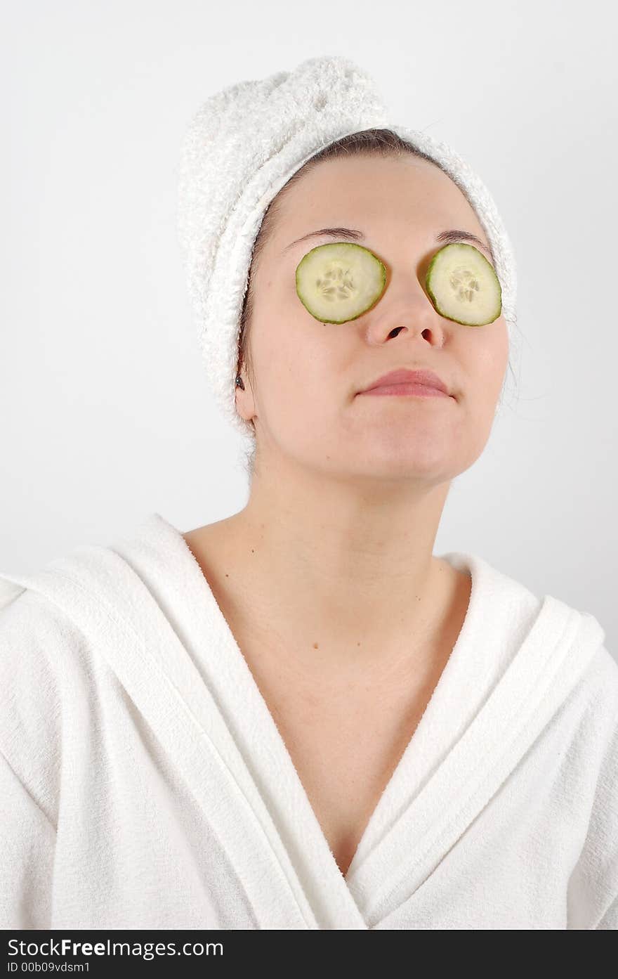 Attractive woman with cucumbers slice on her eyes. Attractive woman with cucumbers slice on her eyes