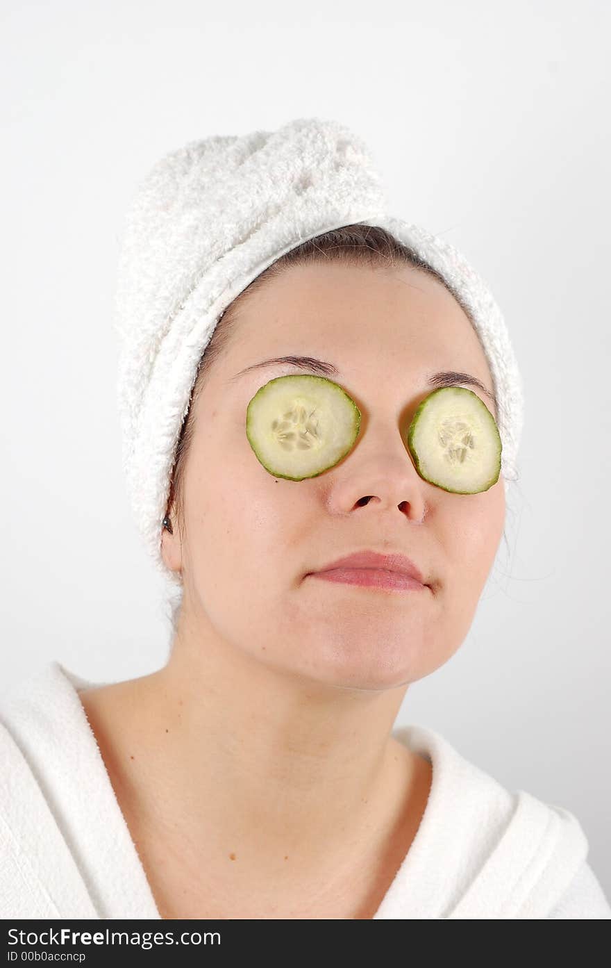 Attractive woman with cucumbers slice on her eyes. Attractive woman with cucumbers slice on her eyes