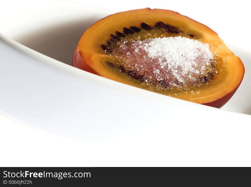 Tropical fruit tamarillo with brown sugar, isolated on white