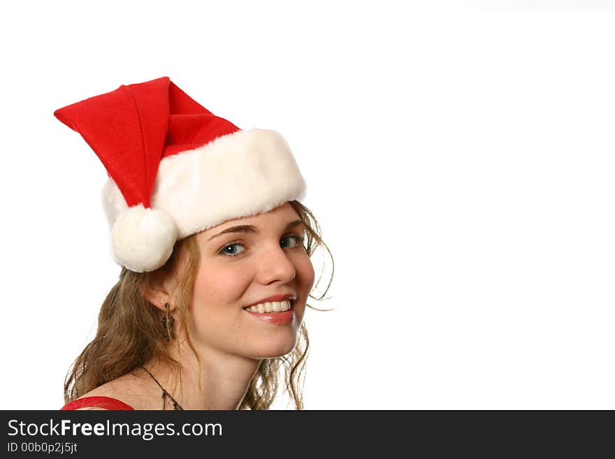 Pretty blonde lady with blue eyes wearing a santa hat and smiling. Pretty blonde lady with blue eyes wearing a santa hat and smiling