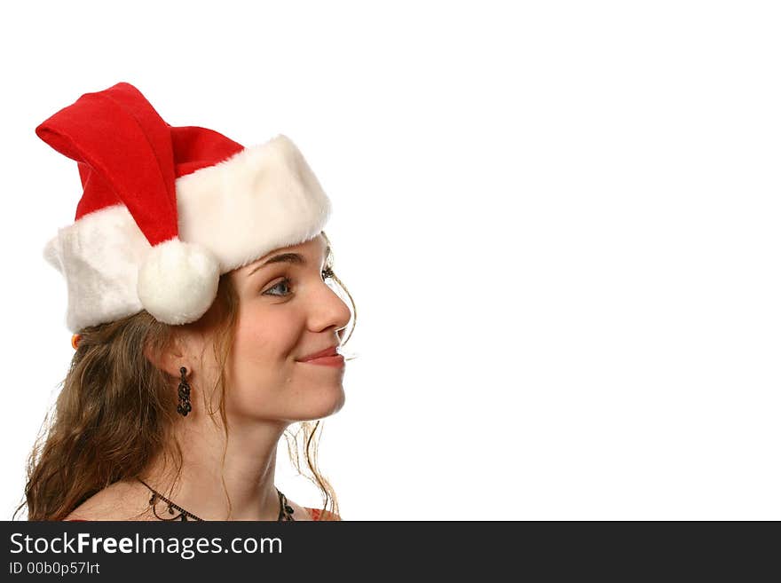 Pretty blonde lady with blue eyes and dimples wearing a santa hat and smiling. Pretty blonde lady with blue eyes and dimples wearing a santa hat and smiling