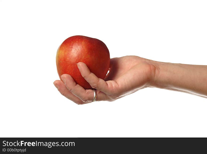 An apple on the hand. An apple on the hand.