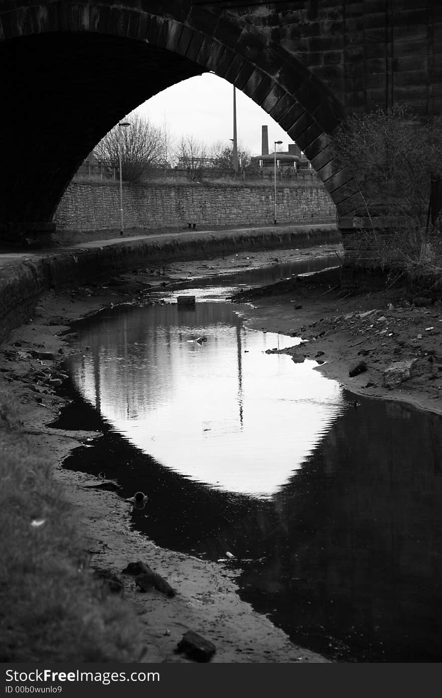 Railway bridge over Leeds canal taken in black and white. Railway bridge over Leeds canal taken in black and white