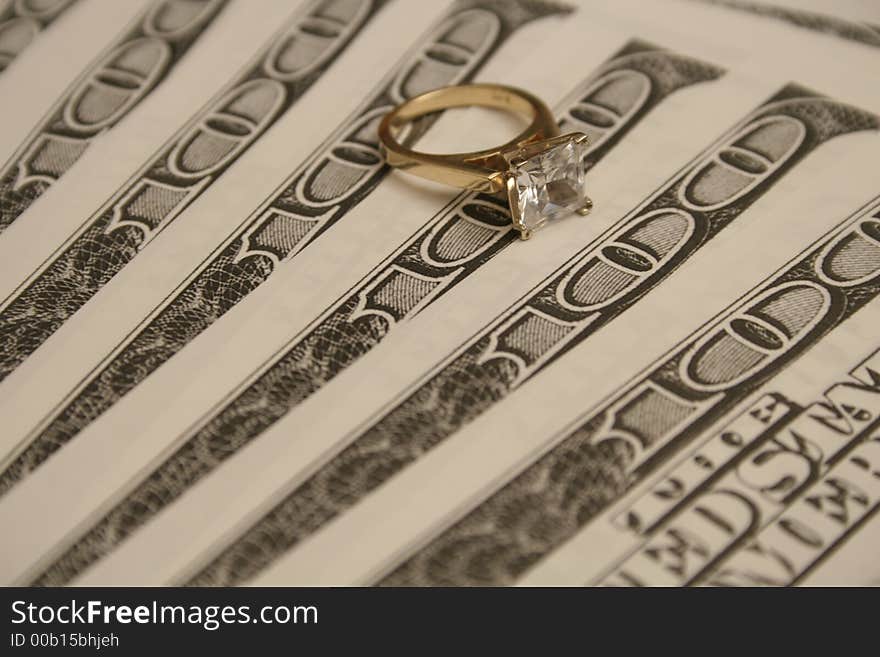 Shot of a diamond ring & money background