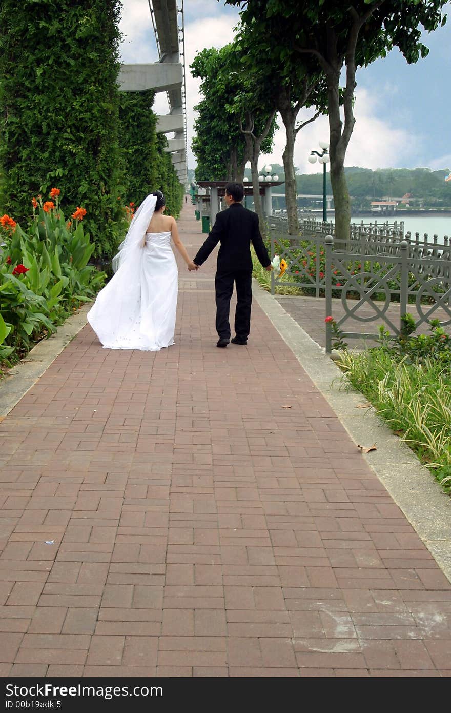 Wedding couple walking along