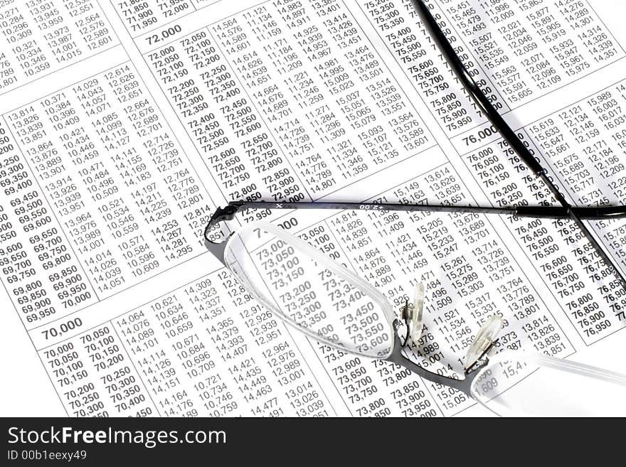 This is an image of a tax rate table and glasses. This is an image of a tax rate table and glasses.