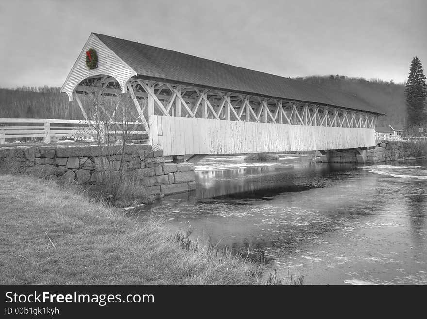 Old new england covered bridge in duotone black and white