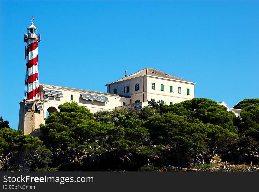 Lighthouse Blitvenica situated on small Croatian island. Lighthouse Blitvenica situated on small Croatian island.