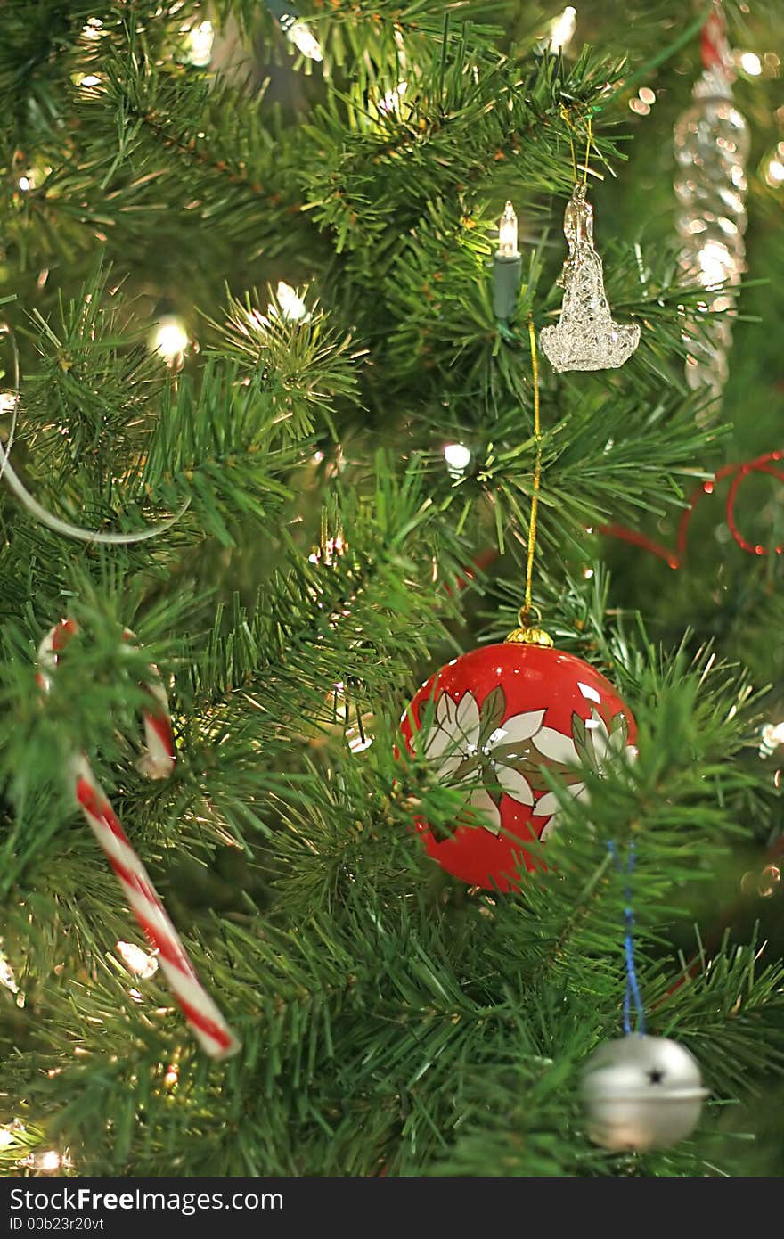 Red Christmas ornament on decorated tree. Red Christmas ornament on decorated tree