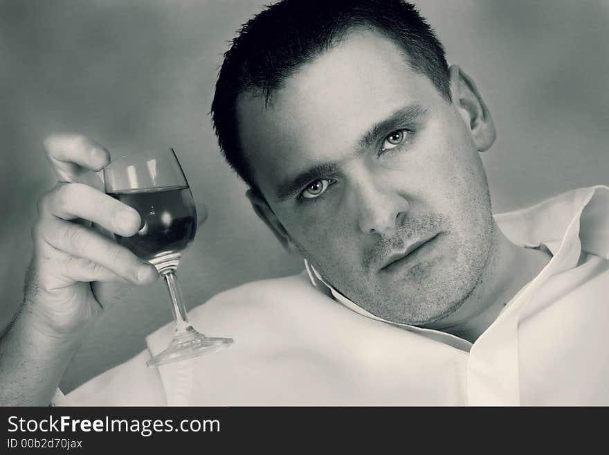 Man holding glass of wine. Man holding glass of wine.