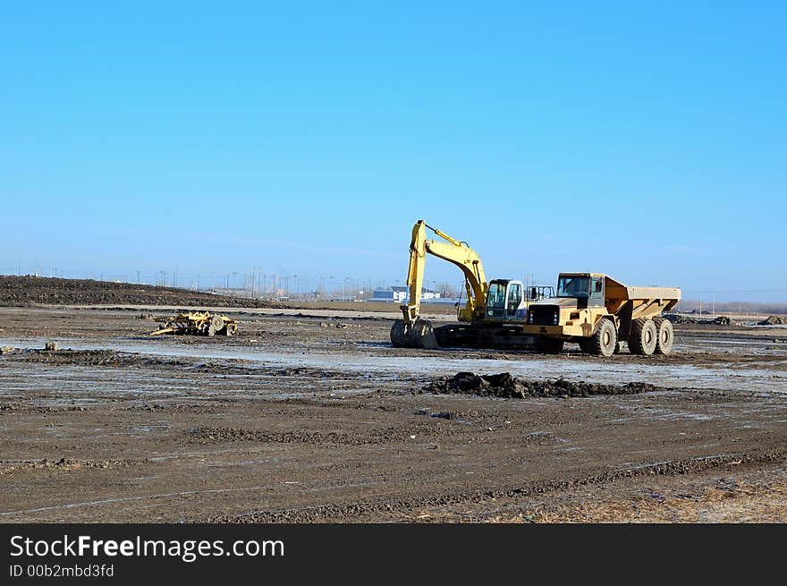 Backhoe and dump truck