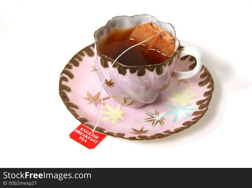 Classic antique tea cup with tea bag. Classic antique tea cup with tea bag.