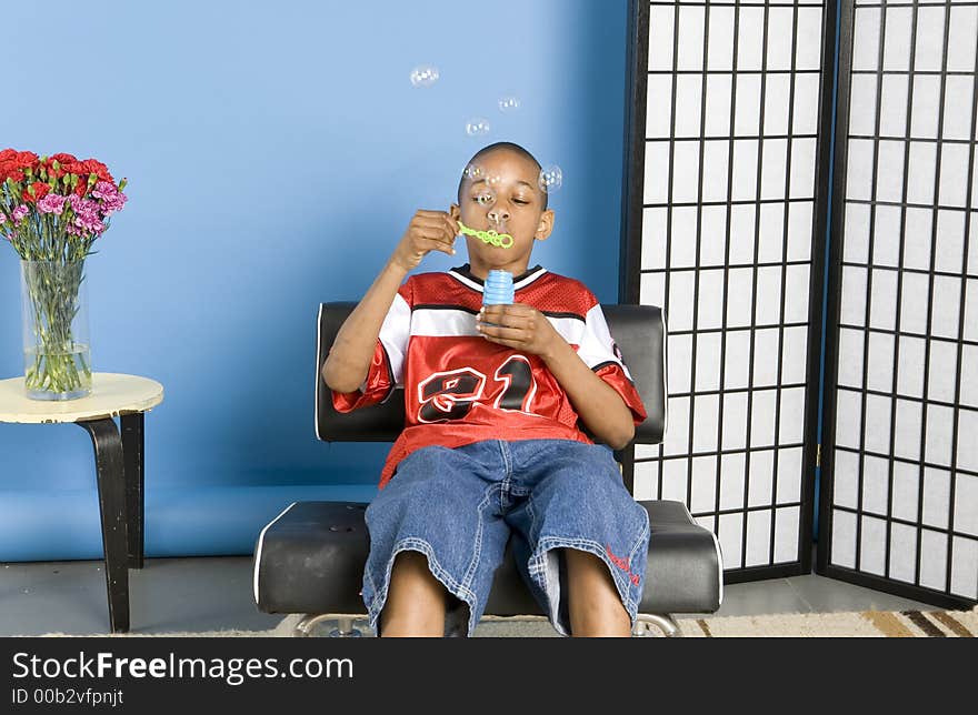 Young Boy Blowing Bubbles