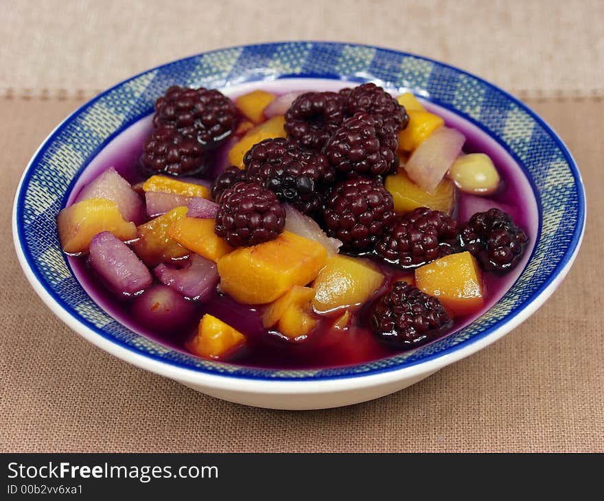 Fruit salad on a bowl with sugar sauce. Fruit salad on a bowl with sugar sauce