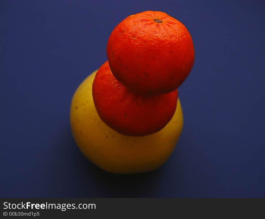 Two Tangerines And A Grapefruit