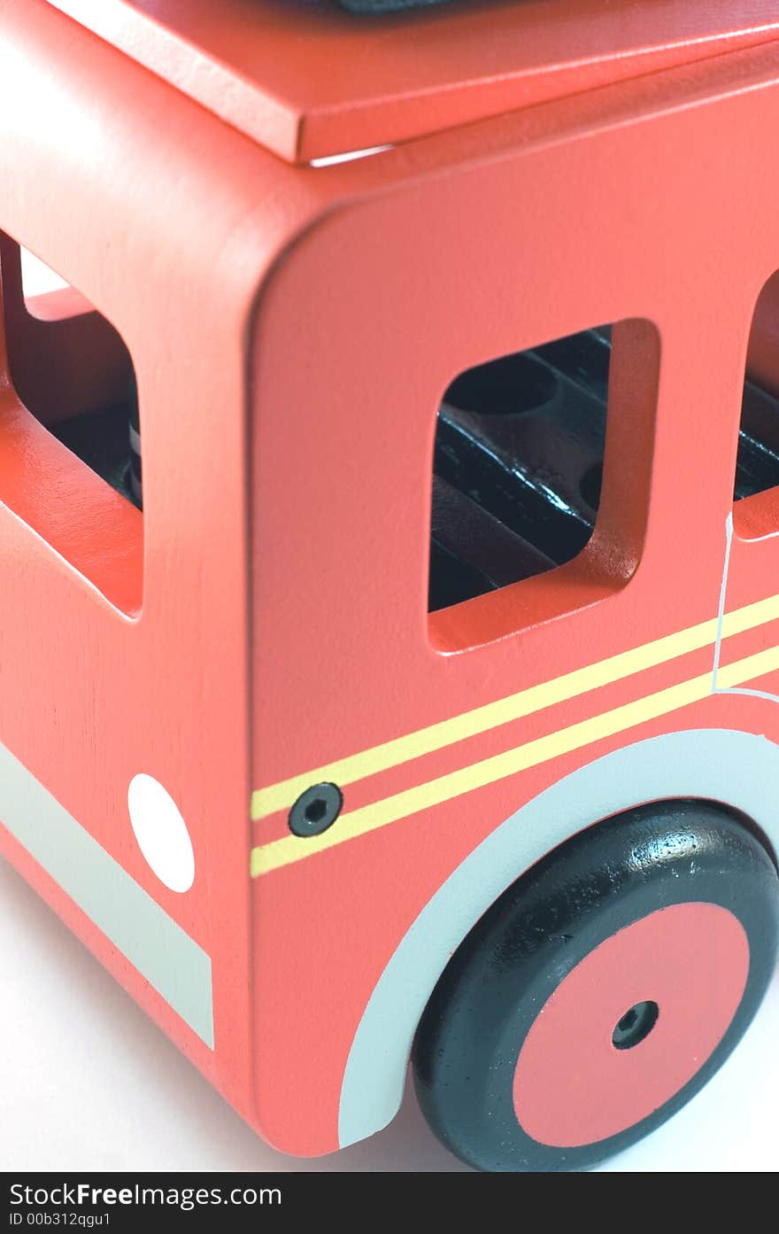 Iamge of a wooden toy fire engine in closeup