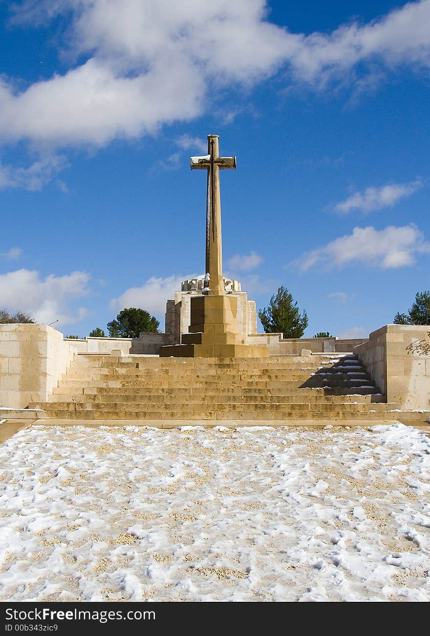 Cross standing with snow, clear skies in background. Cross standing with snow, clear skies in background