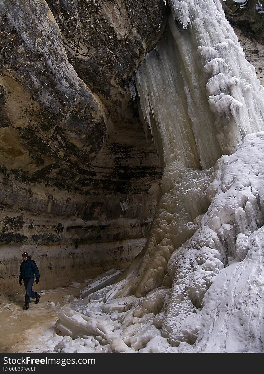 Women behind frozen waterfall 2