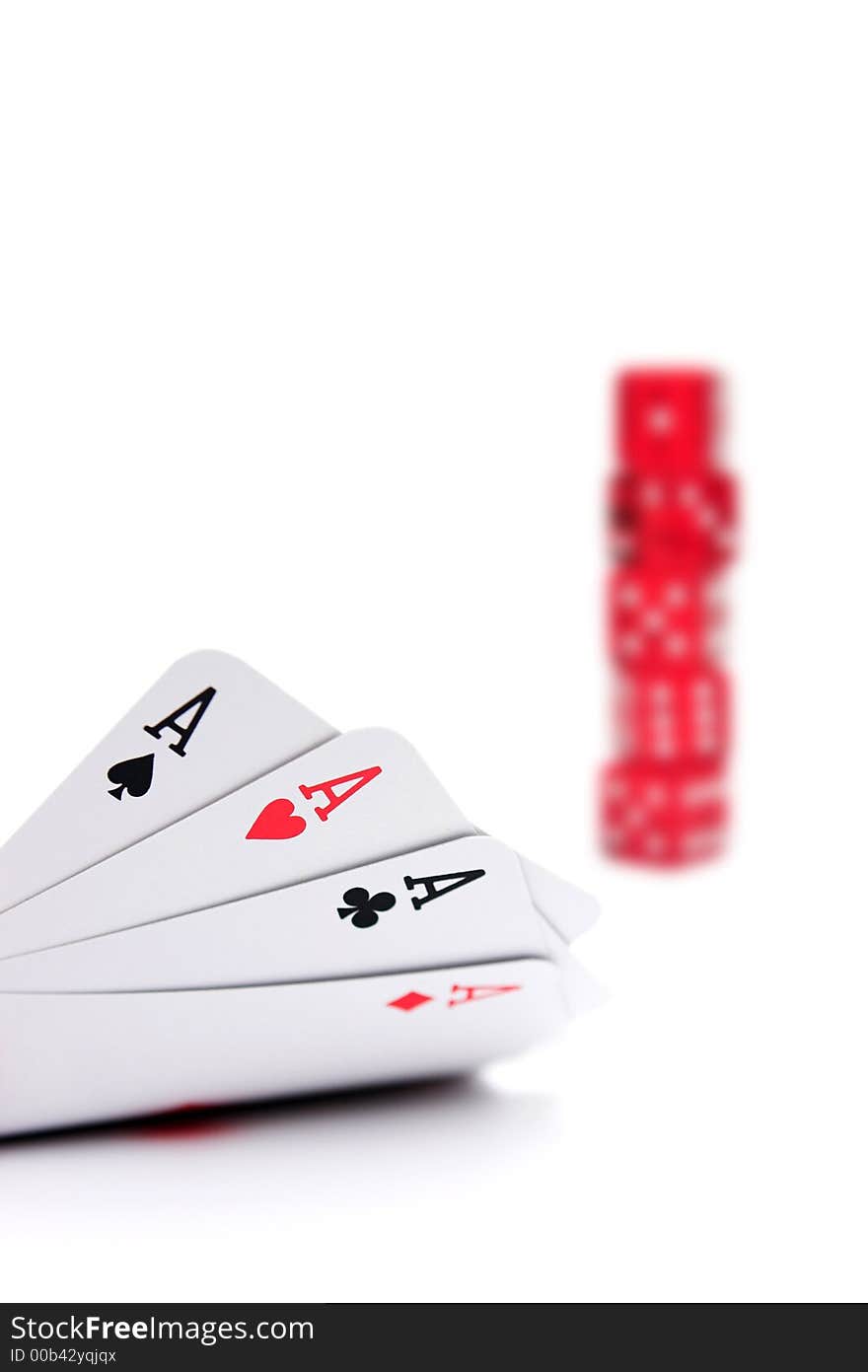 Aces high with out of focus stack of poker dice in the background - shallow dof on white. Aces high with out of focus stack of poker dice in the background - shallow dof on white