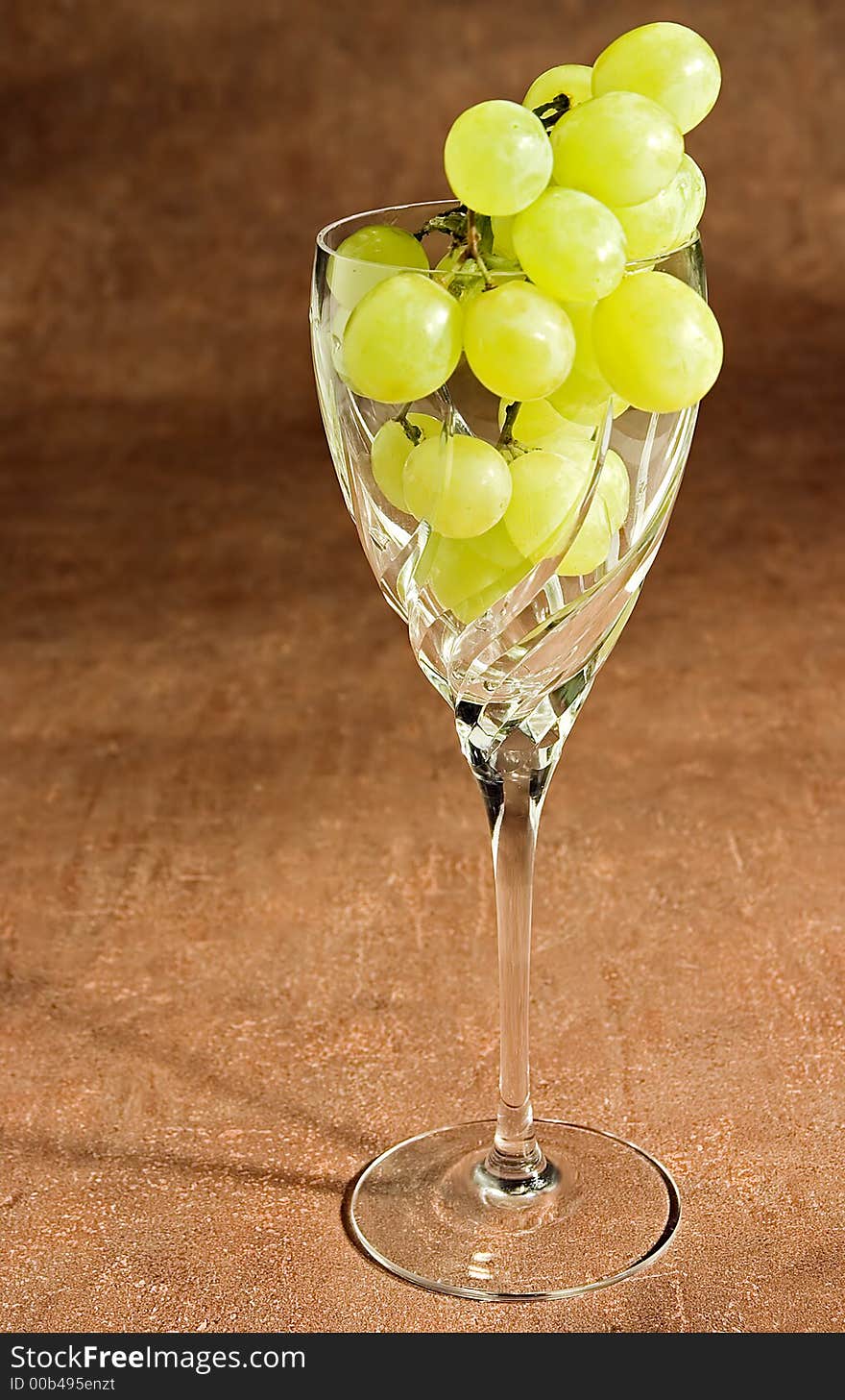 A glass filled with grapes. A glass filled with grapes