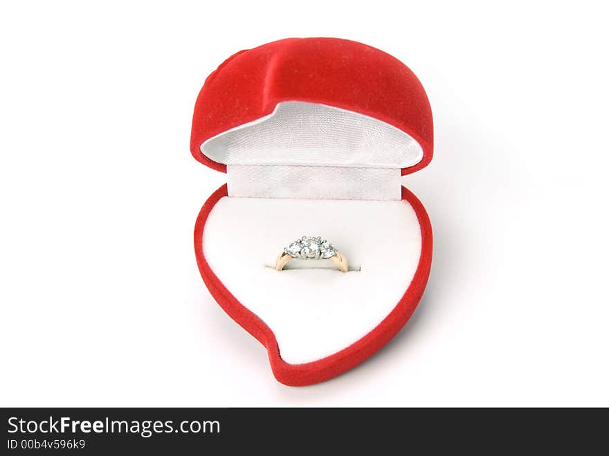 Engagement ring in heart shaped ring box. Engagement ring in heart shaped ring box.