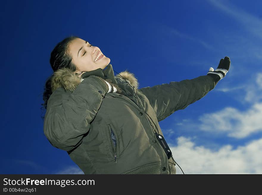 Young, beautiful and happy girl with mp3 player. Young, beautiful and happy girl with mp3 player