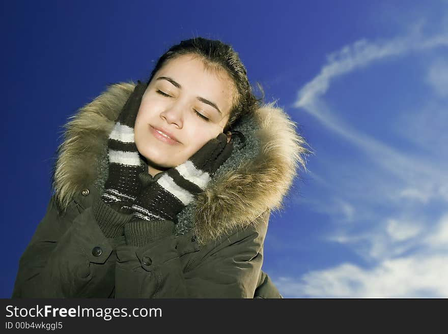 Beautiful young girl listening music