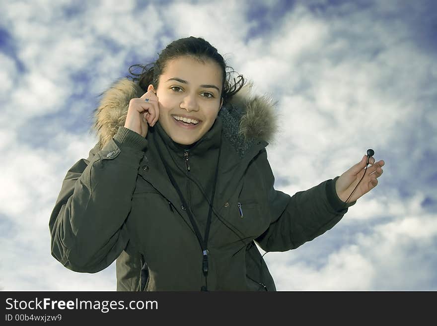 Young, beautiful and happy girl with mp3 player. Young, beautiful and happy girl with mp3 player