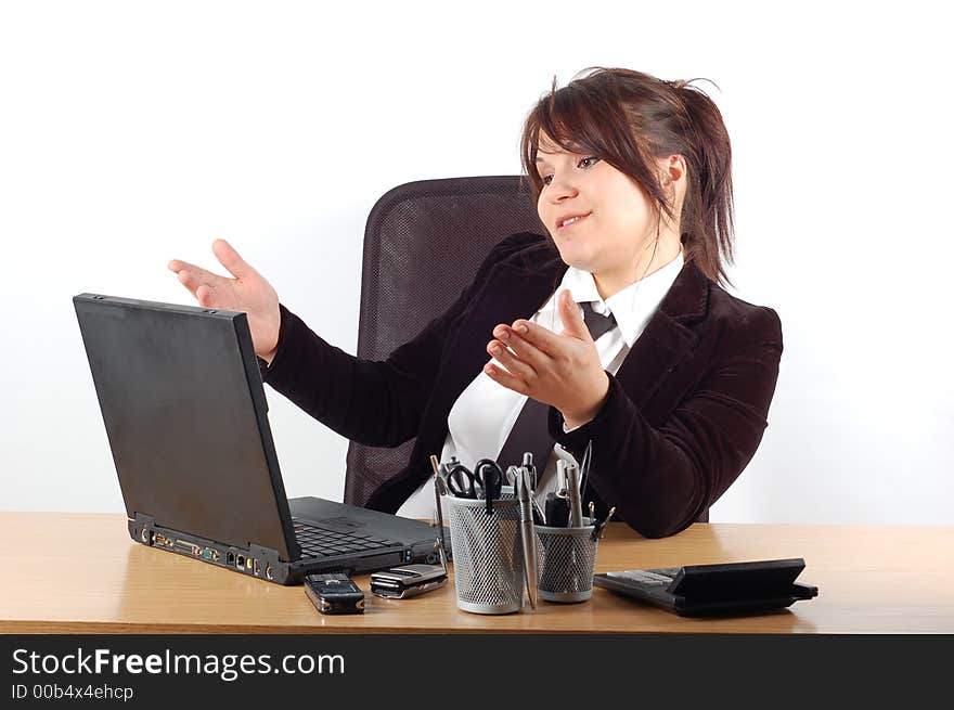 Attractivw woman at desk with laptop on white background. Attractivw woman at desk with laptop on white background