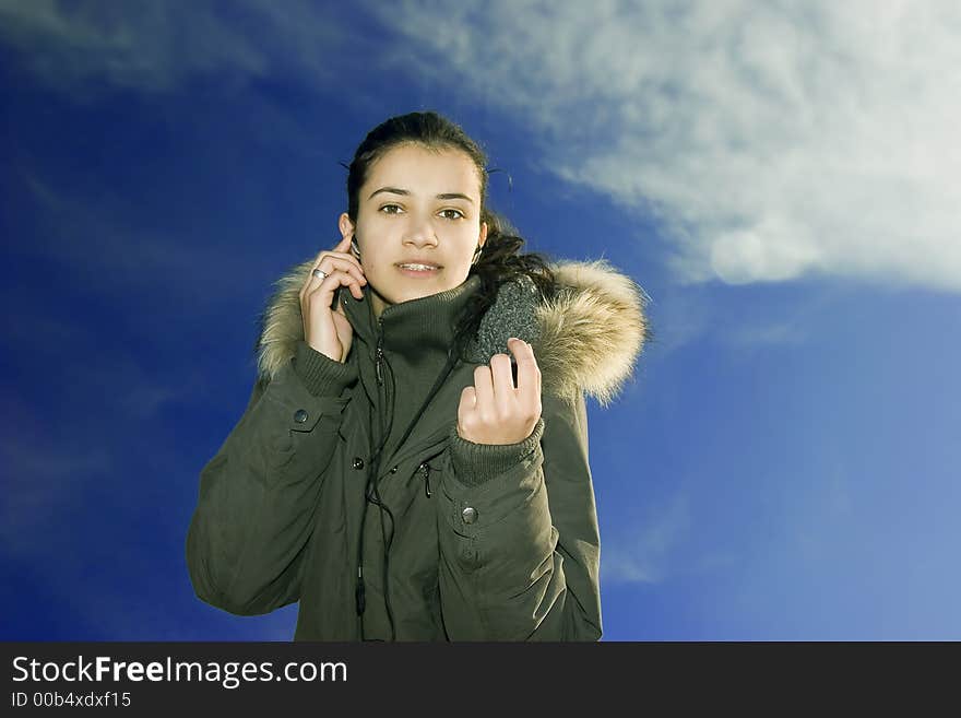 Beautiful young girl listening music