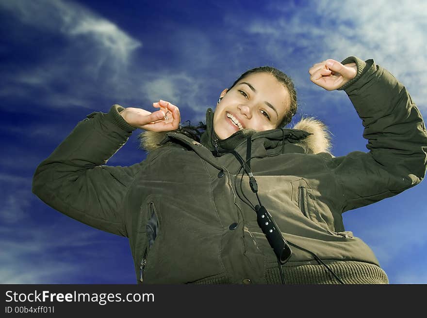 Beautiful young girl listening music