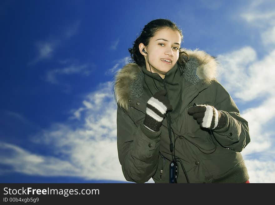 Young, beautiful and happy girl with mp3 player. Young, beautiful and happy girl with mp3 player