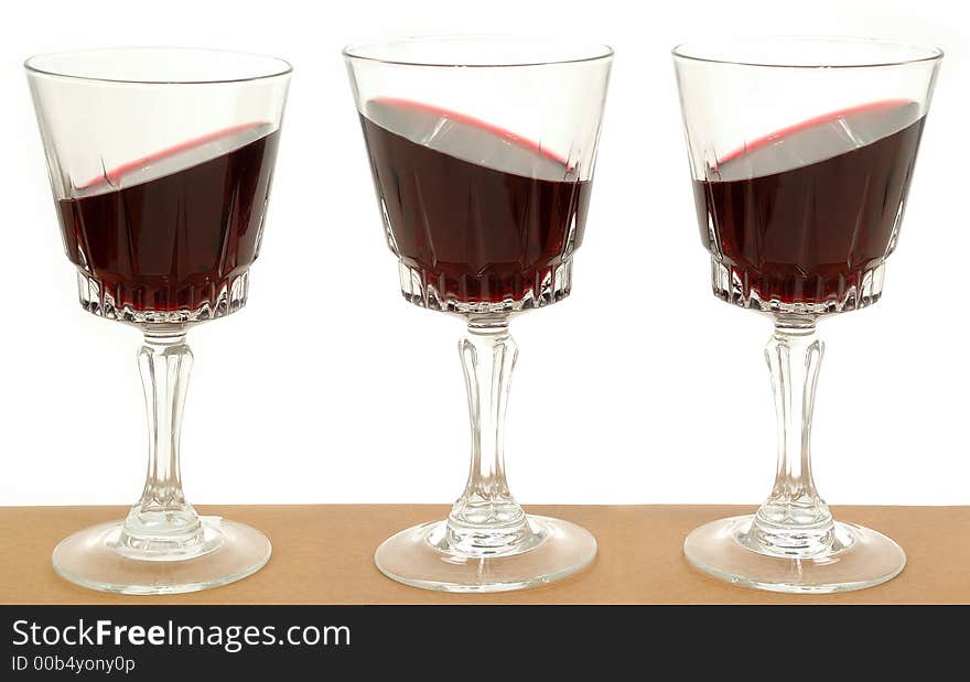 Three wineglasses and gravity