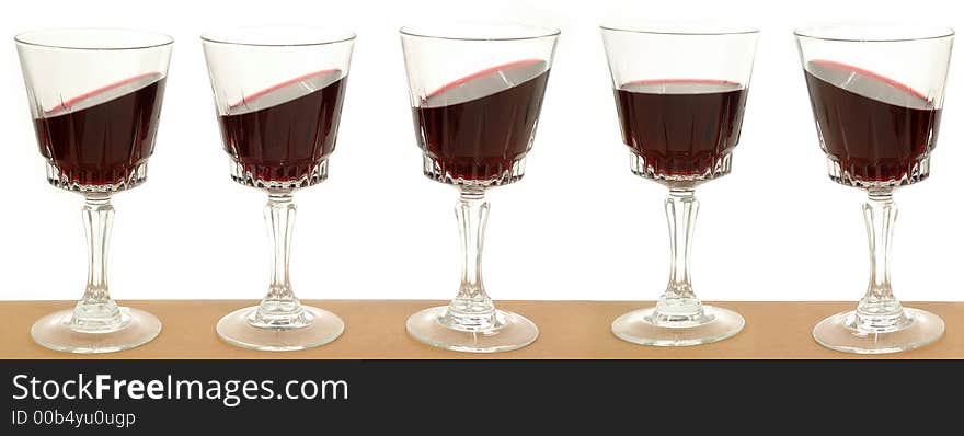 Five wineglasses on a line