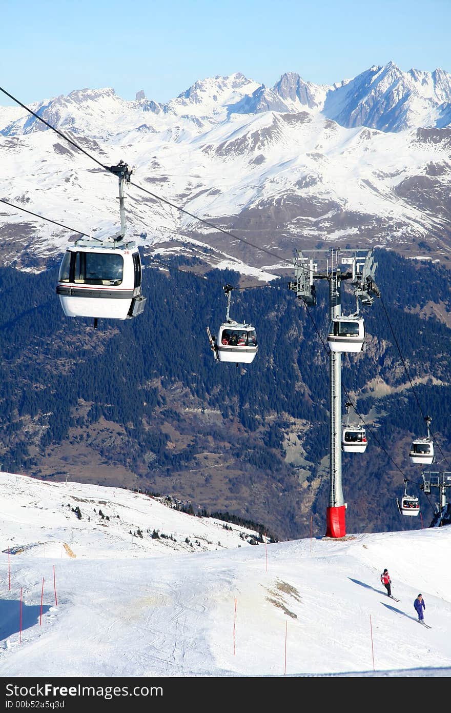 These gondolas transport skiers up and down the mountain. These gondolas transport skiers up and down the mountain