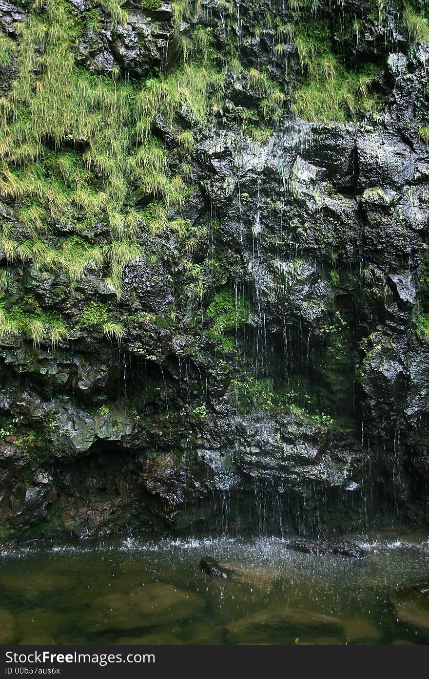 Exotic dark waterfall at the end of bamboo forrest. Exotic dark waterfall at the end of bamboo forrest